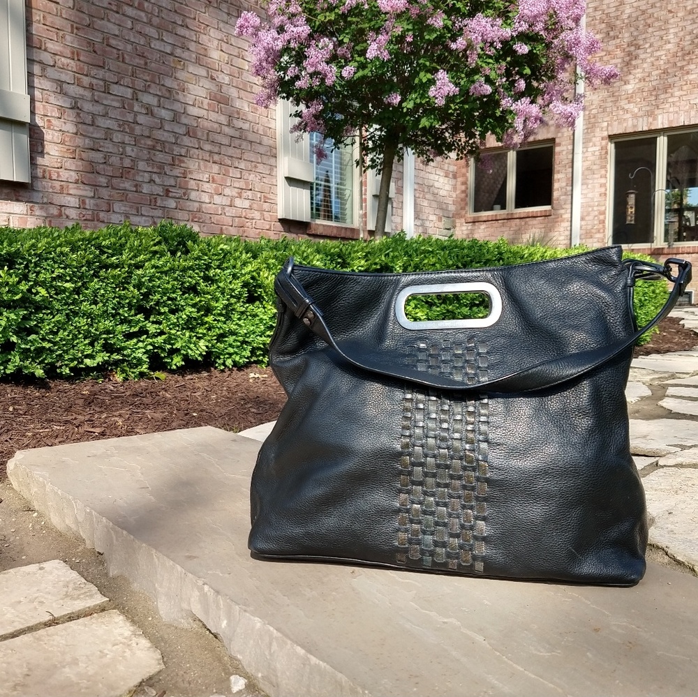 Black Calvin Klein purse with detailed front